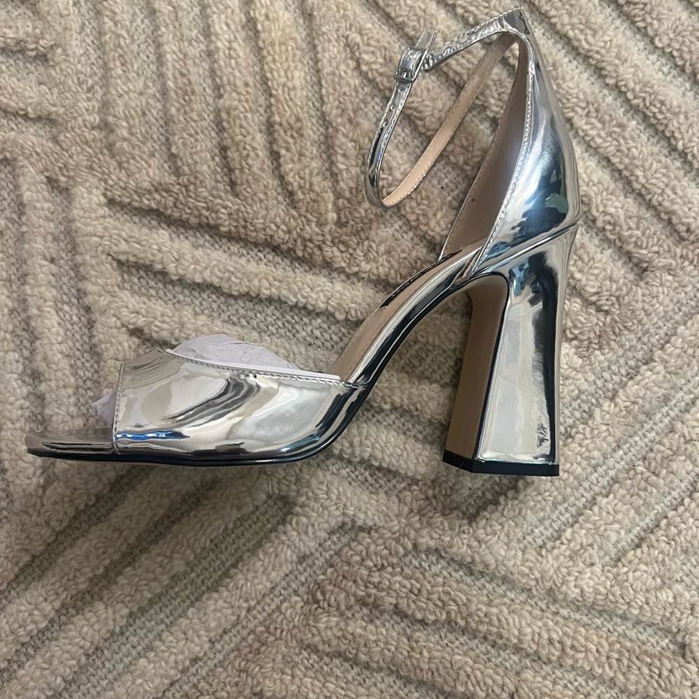 Never worn Nine West ankle strap silver mirrored block heels.
